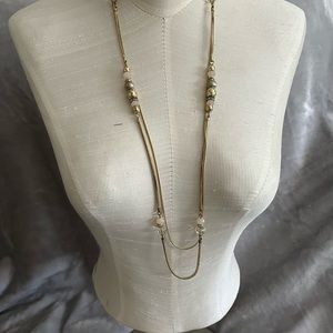 Gold colored metal double chain station necklace
